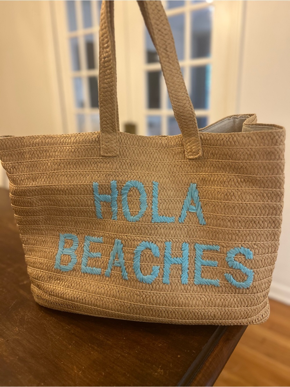 Beige Straw Tote Bag with Blue "HOLA BEACHES" Embroidery